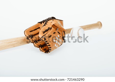 Closeup shot of baseball equipment - bat, ball and mitt isolated on white