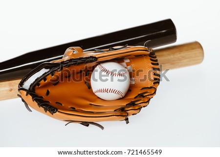Closeup shot of baseball equipment - bats, ball and mitt isolated on white