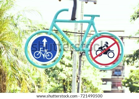 The symbol through specific driving bicycle not driving motorcycle in this lane in the
University of Thailand. This image was blurred or selective focus.