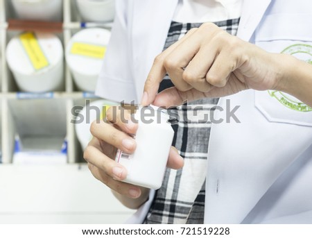 Woman carrying drugs while working t the office of the hospital.