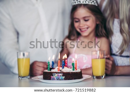 Cropped image of happy family is celebrating little daughter's Birthday