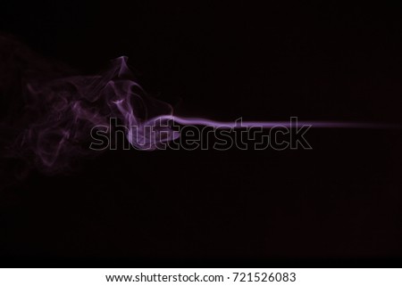 Purple smoke on black background.