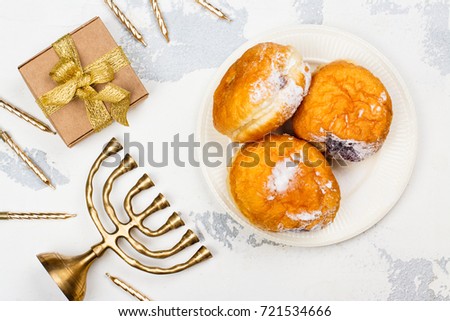 Happy Hanukkah background with menorah, burning candles and donuts. Space for text