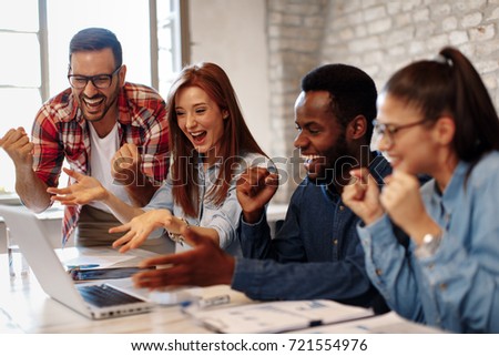 Good news young team in the office Royalty-Free Stock Photo #721554976