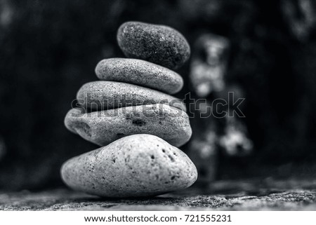 Sea glass pebbles are stacked on top of each other. concept of unity and team work.