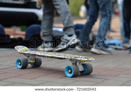 skateboard with skateboarder in park