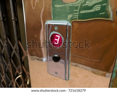 Old elevator button with number three