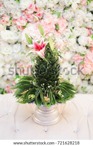 Betel trellis or known as "Sireh Junjung" in Malay culture wedding with nice arrangement over lovely floweriest background Royalty-Free Stock Photo #721628218