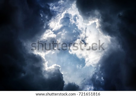 Light in the Dark and Dramatic Storm Clouds Royalty-Free Stock Photo #721651816