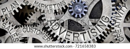 Macro photo of tooth wheel mechanism with ADVERTISING, SALES, PLAN, CREATIVITY, CUSTOMER, MARKETING concept words Royalty-Free Stock Photo #721658383