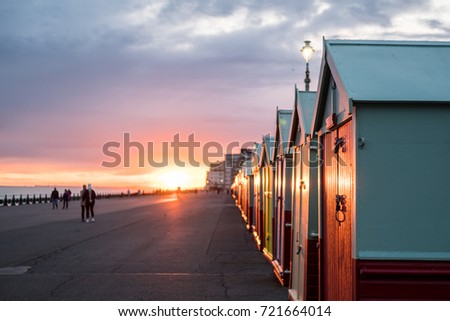 Colorful Beach Huts during sunset at Brighton and Hove, England Royalty-Free Stock Photo #721664014