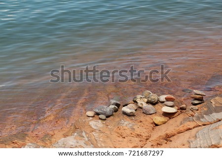 pebbles on lake Powell bank  blue near the water