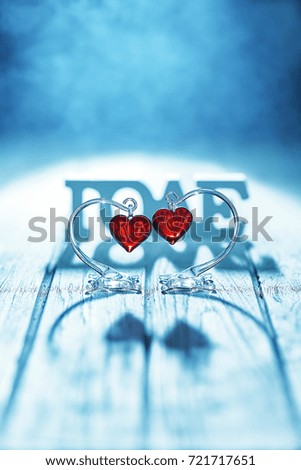 Love concept, shadow of love letter with two red heart on wood background filter blue tone effect