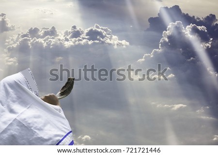 Jewish man in Tallit blowing the Shofar (horn) of Rosh Hashanah (New Year Jew).Yom kippur Religious and Holidays symbol concept. Royalty-Free Stock Photo #721721446