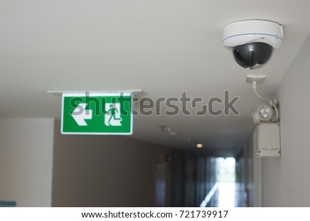 cctv camera security and Fire exit sign Inside the building.
