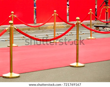 Red carpet entrance with golden stanchions and ropes. Celebrity nominees to premiere. Stars on the festive awarding of prizes awards