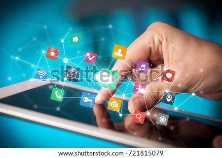 Female hands touching tablet with colorful applications