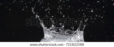 Water moving on black background, water droplets