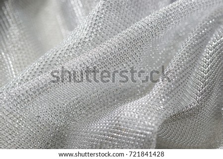 Macro picture of a silver decorative fabric. Silver background. 