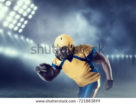 American football player with ball on sport arena
