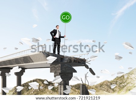 Confident businessman in suit holding green go sign while standing among flying paper planes on broken bridge with skyscape and nature view on background. 3D rendering.