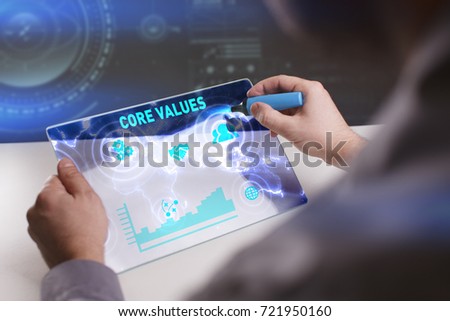 Business, Technology, Internet and network concept. Young businessman working on a virtual screen of the future and sees the inscription: Core values