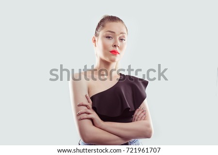 Vaiglorious. Closeup portrait unhappy grumpy young bossy woman skeptical student worker arms crossed asking what's the problem who cares so what. Isolated light white background. Negative emotions Royalty-Free Stock Photo #721961707