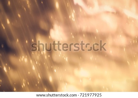 Golden abstract sparkles or glitter lights. Festive gold background.defocused circles bokeh or particles. Christmas temlate