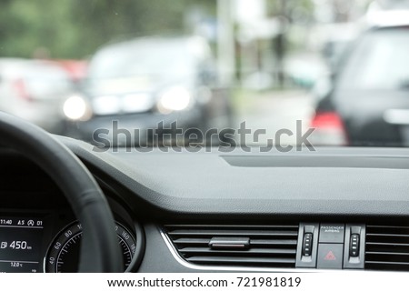 Car interior and traffic. Royalty-Free Stock Photo #721981819
