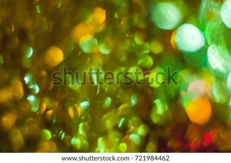 Abstract yellow and green tones blurred background with bokeh lights
