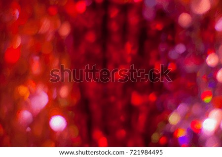 Abstract red tones blurred background with bokeh lights