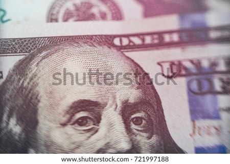 Macro close up of Ben Franklin's face on the US 100 dollar bill.