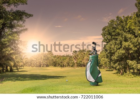 Golf equipment and golf bag ,putter ,ball on green as  flag and hole at golf course  background.concept go to success.