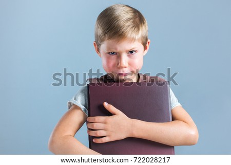 Portrait Funny Little Pupil Boy with Book Child Prodigy Copy Space Concept Back to School Blue Background