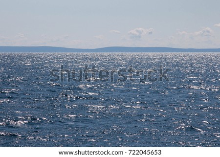 Shimmering water of Lake Superior and a distant Apostle islands