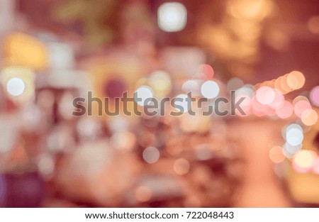 Abstract blurred Street  night market with bokeh for background usage . (vintage tone)