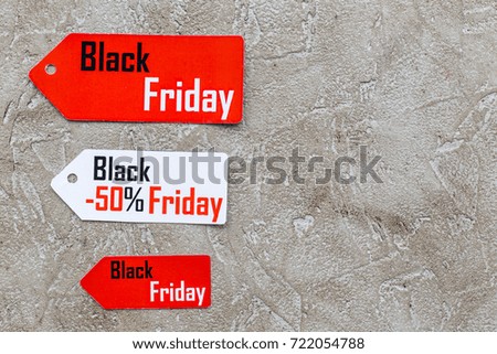 Words black friday on colored labels on light background top view copyspace