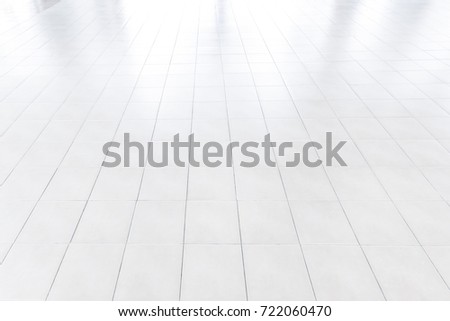 white tile floor in office.White tiles floor for bedroom , kitchen, bathroom and interior design.White tiles floor in perspective view. Clean and symmetrical surface with grid texture background.