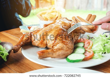 People Party and eating grilled chicken are happy enjoying in home