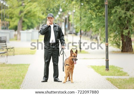 Security guard with dog in park
