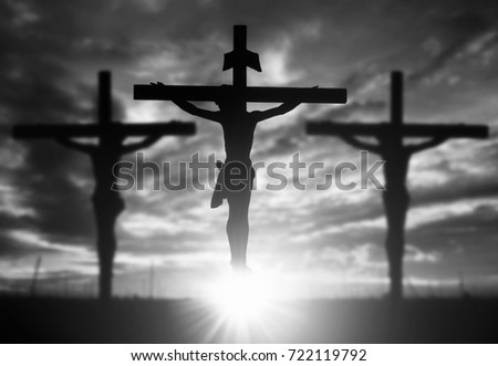Silhouette of Jesus with Cross over sunset concept for religion, worship, Christmas, Easter, Redeemer Thanksgiving prayer and praise