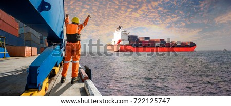Panorama, Container ship vessel leaving departure from the port terminal after completion of loading/discharging operation by gang of mooring attending at last party with sunset scenery in background Royalty-Free Stock Photo #722125747