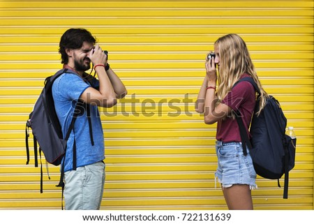 Couple taking photos of each other