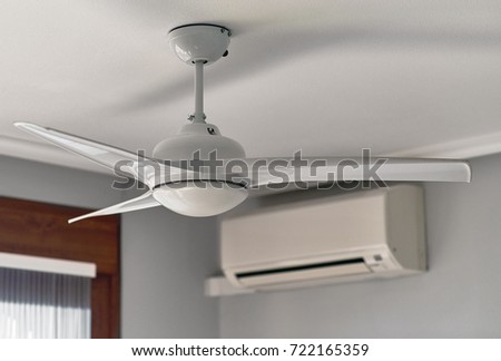 Ceiling fan and air conditioning Royalty-Free Stock Photo #722165359