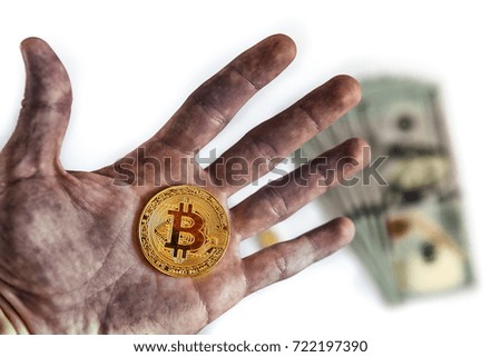Mining, man holds in his hands the symbol of the new crypto currency bitcoin extracted from computers in the high-tech era that replaced the mining miners of gold