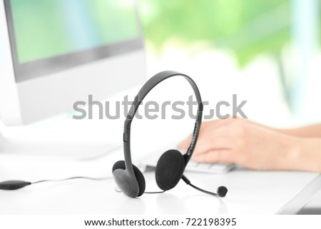 Headset on table of technical support agent