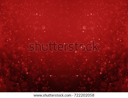 Glitter light red bokeh christmas night blurred black background  Royalty-Free Stock Photo #722202058