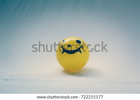 Self Made hand drown Smiley face Halloween Spooky balls in yellow with white background - copy space template for your wording