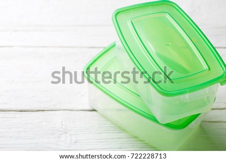 Image of two containers with green lid
