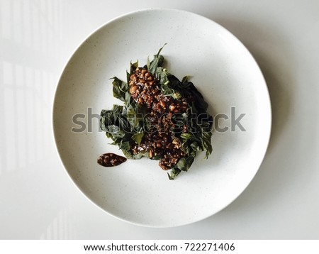 Tapioca leaf / Cassava is a major staple food in the developing world providing a basic diet for over half a billion people Royalty-Free Stock Photo #722271406